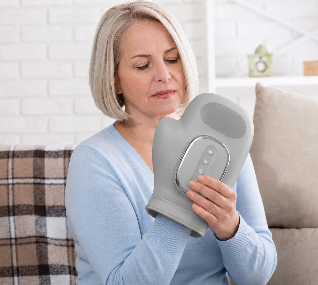 Woman using Thermid hand massager at home